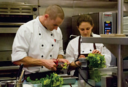 Juliet and Tyson prepping in the kitchen