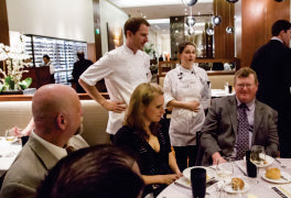 Chef Daniel Corey accompanies Juliet as she speaks to the judges