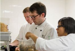 Maree and Christopher working alongside Chef Daniel Corey.